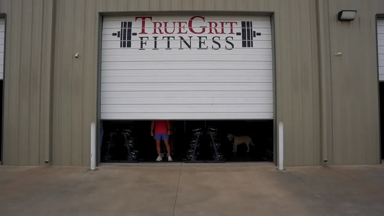 Inside True Grit Fitness, with members training on the gym floor